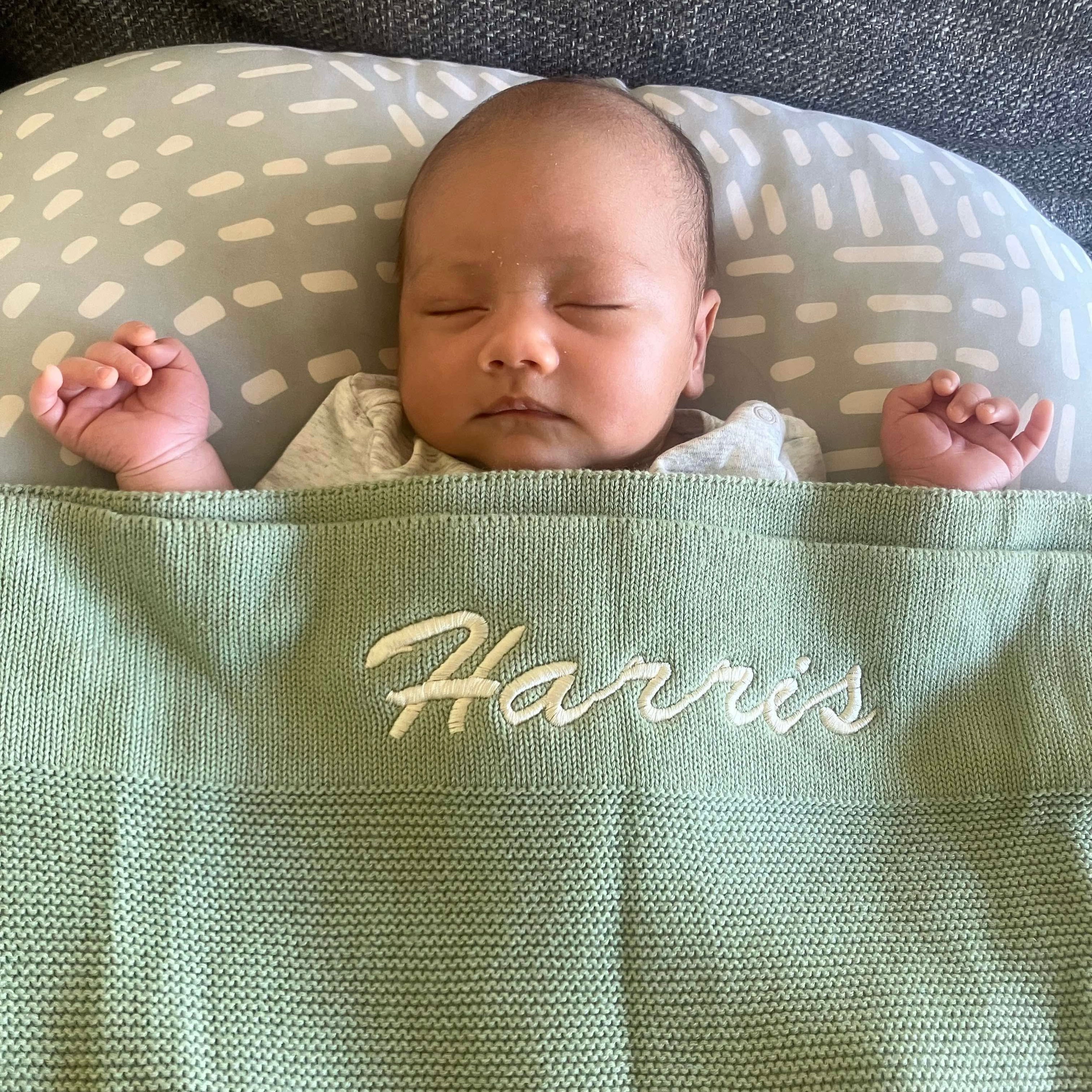 Embroidered baby blanket with baby sleeping 