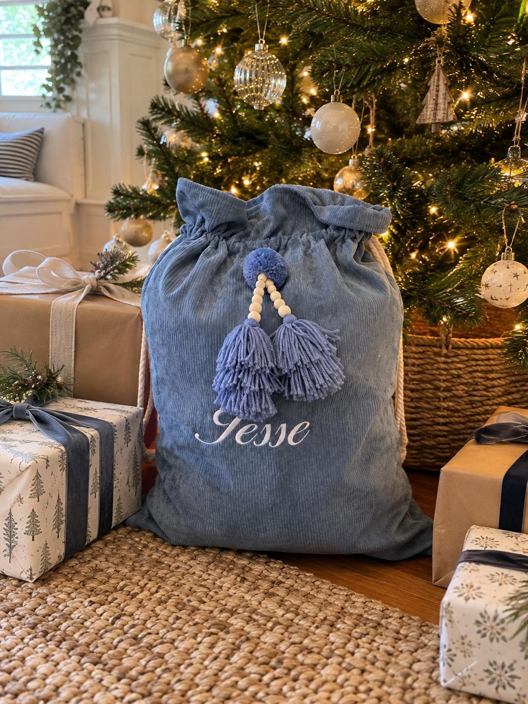 Blue personalised corduroy Santa sack with script embroidered name and beaded tassels
