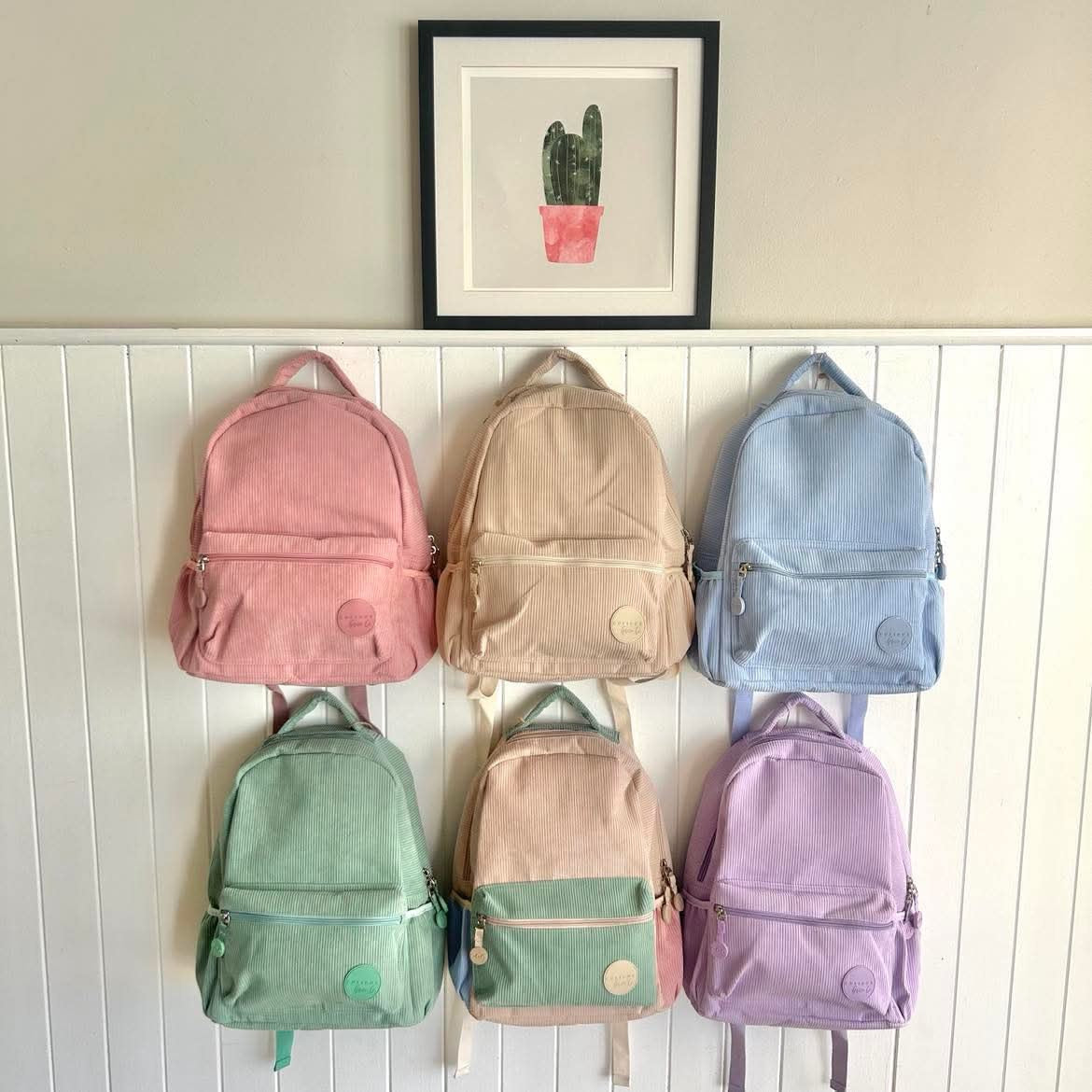 Corduroy backpack with personalised option in pink, beige, blue, green, multi and purple colour ways. Perfect for child care, kindy, prep & school. 