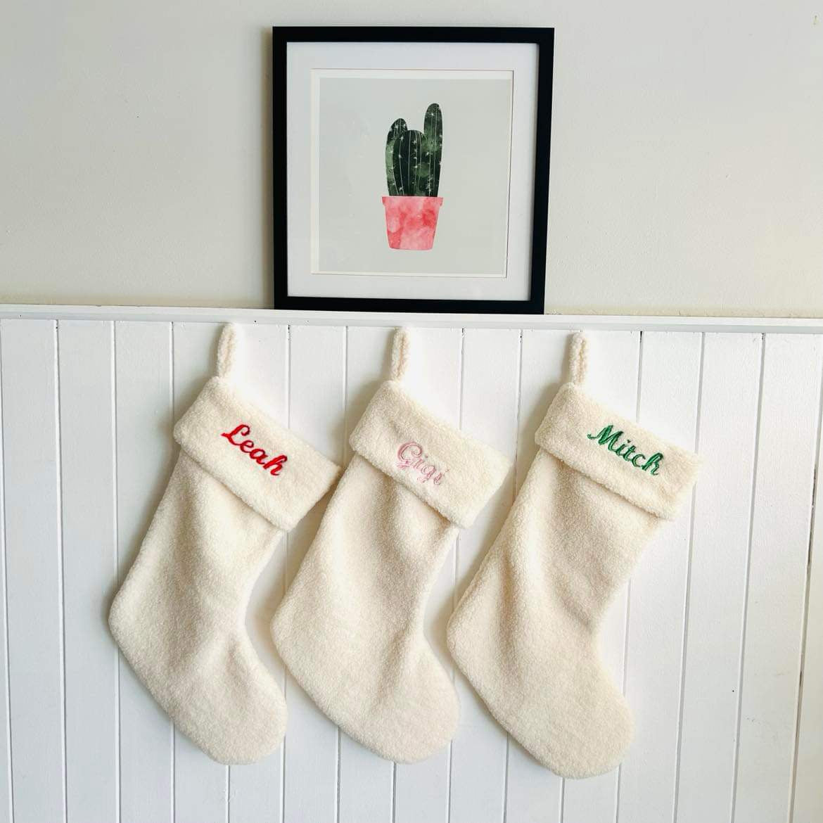 Personalised Christmas Stocking with stunning red, green and pink embroidery on a teddy bear Christmas stocking by Curious Grace Co.