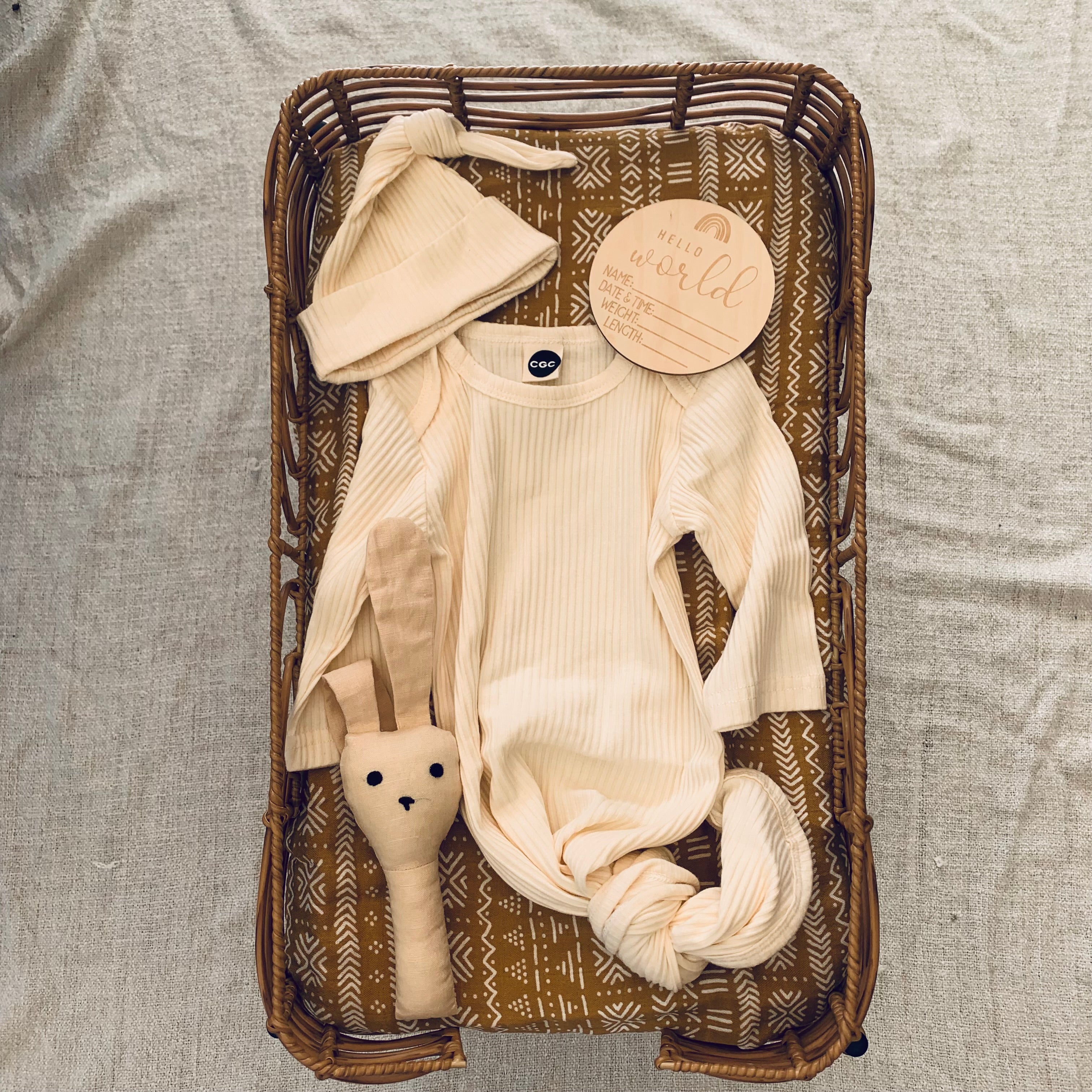 cheap baby announcement set.  Adorable ribbed cotton sleeping bag with beanie in cream, baby details disc and rattle 